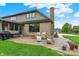 Backyard patio and seating with well manicured lawn at 5255 Apache Moon, Carmel, IN 46033