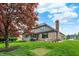 Backyard with large manicured lawn, brick patio and seating at 5255 Apache Moon, Carmel, IN 46033