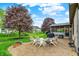Spacious backyard patio featuring an outdoor seating area and manicured lawn at 5255 Apache Moon, Carmel, IN 46033