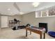 Basement featuring a treadmill, foosball table, and natural light, for fitness and fun at 5255 Apache Moon, Carmel, IN 46033