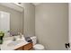 Stylish powder room featuring modern sink, mirror, and fixtures at 5255 Apache Moon, Carmel, IN 46033