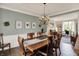 Dining room with hardwood floors, chandelier and decorative trim at 5255 Apache Moon, Carmel, IN 46033