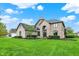 Stately brick home with beautiful landscaping and mature trees at 5255 Apache Moon, Carmel, IN 46033