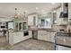 Beautiful kitchen with white cabinets, stainless steel appliances, and a large island with bar seating at 5255 Apache Moon, Carmel, IN 46033