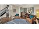 Open floor plan from living room to dining room featuring hardwood floors and natural lighting at 5255 Apache Moon, Carmel, IN 46033