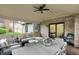 Inviting screened porch has dining table and comfortable seating with natural light at 5255 Apache Moon, Carmel, IN 46033