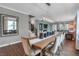 Elegant dining room featuring a modern light fixture and stylish decor at 5291 Nettleton Way, Avon, IN 46123