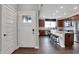 Charming entryway view leading into kitchen with stainless steel appliances and countertop seating at 5291 Nettleton Way, Avon, IN 46123