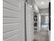 Hallway featuring sliding barn doors leading to additional living space, offering an open and inviting feel at 5291 Nettleton Way, Avon, IN 46123