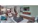Open-concept living room with plush seating, wood floors, and stylish decor at 5291 Nettleton Way, Avon, IN 46123