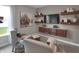 Comfortable sitting area featuring plush seating, built-in shelving, and natural light, creating an inviting space at 5291 Nettleton Way, Avon, IN 46123