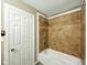 Bathroom with tile shower and white door at 5305 N Cork Dr, Muncie, IN 47304