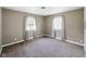 Cozy bedroom featuring neutral walls, carpet flooring, and natural light at 5305 N Cork Dr, Muncie, IN 47304