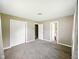 Neutral bedroom with closet, carpet, and access to another room at 5305 N Cork Dr, Muncie, IN 47304