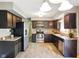 Spacious kitchen with stainless steel appliances, tiled backsplash, and ample cabinets at 5305 N Cork Dr, Muncie, IN 47304