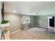 Living room with brick fireplace and large window at 5305 N Cork Dr, Muncie, IN 47304