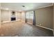 Cozy living room with a brick fireplace and a large window at 5305 N Cork Dr, Muncie, IN 47304