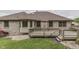 Backyard showcasing a deck and landscaped area at 5499 Steven Dr, Greenwood, IN 46142