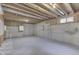 Unfinished basement with exposed ceiling, concrete walls, and painted concrete floor at 5499 Steven Dr, Greenwood, IN 46142