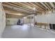 Unfinished basement with exposed framing, concrete walls and floor, and fitness equipment at 5499 Steven Dr, Greenwood, IN 46142