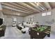 Finished basement with foosball table, white sofa, and exposed wood ceiling at 5499 Steven Dr, Greenwood, IN 46142