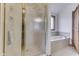 Bathroom featuring a glass-enclosed shower and soaking tub with tile surround at 5499 Steven Dr, Greenwood, IN 46142