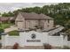 Brick home near Brookstone entrance, featuring a side-entry garage and waterfront landscaping at 5499 Steven Dr, Greenwood, IN 46142