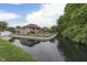 Brick house on the water with beautiful landscaping and a spacious yard at 5499 Steven Dr, Greenwood, IN 46142