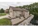 Charming brick home with a side garage and waterfront view surrounded by rock landscaping at 5499 Steven Dr, Greenwood, IN 46142