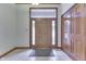 Spacious foyer featuring neutral tile flooring and ample closet space for organized storage at 5499 Steven Dr, Greenwood, IN 46142