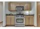 Kitchen featuring stainless steel appliances and wood cabinets at 5499 Steven Dr, Greenwood, IN 46142