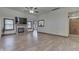 Spacious living room with fireplace, large windows, and hardwood floors, bathed in natural light at 5499 Steven Dr, Greenwood, IN 46142