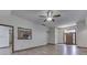 Open-concept living room with hardwood floors, crown molding, and a view into the kitchen at 5499 Steven Dr, Greenwood, IN 46142