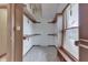 Walk-in closet with wooden shelving and a window for natural light at 5499 Steven Dr, Greenwood, IN 46142