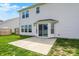 Bright backyard featuring a concrete patio and well-maintained lawn, perfect for outdoor relaxation at 5518 Wood Spring Ln, McCordsville, IN 46055