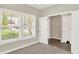 Bright bedroom featuring two windows and a closet with tiled flooring, offering comfortable living space at 5518 Wood Spring Ln, McCordsville, IN 46055