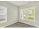 Serene bedroom with ample natural light, plush carpeting, and a calming neutral color palette at 5518 Wood Spring Ln, McCordsville, IN 46055