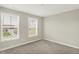 Bright bedroom featuring neutral paint, carpet flooring, and large windows for plenty of natural light at 5518 Wood Spring Ln, McCordsville, IN 46055