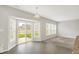 Bright dining area features hardwood floors, many windows, and sliding glass door leading to the backyard at 5518 Wood Spring Ln, McCordsville, IN 46055
