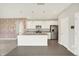 Bright kitchen featuring stainless steel appliances, granite countertops, and center island at 5518 Wood Spring Ln, McCordsville, IN 46055