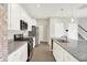 Kitchen with white cabinets, granite countertops, and stainless steel appliances at 5518 Wood Spring Ln, McCordsville, IN 46055