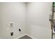 The unfinished laundry room has tiled floor, modern shelving, and utility connections at 5518 Wood Spring Ln, McCordsville, IN 46055