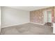 Open-concept living room featuring carpet floors and a decorative accent wall at 5518 Wood Spring Ln, McCordsville, IN 46055