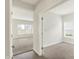 Open-concept living room with plush carpeting, natural light, and seamless flow into other living spaces at 5518 Wood Spring Ln, McCordsville, IN 46055