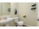 Half bathroom features a single sink vanity, toilet, and tile flooring at 5646 Skipping Stone Dr, Indianapolis, IN 46237