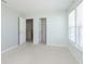 Neutral bedroom with carpet, a bright window, and access to a closet and adjoining room at 5646 Skipping Stone Dr, Indianapolis, IN 46237
