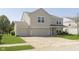 Charming two-story home featuring a two-car garage and well-maintained front lawn at 5646 Skipping Stone Dr, Indianapolis, IN 46237