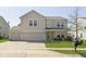 Charming two-story home featuring a two-car garage and well-maintained front lawn at 5646 Skipping Stone Dr, Indianapolis, IN 46237
