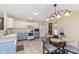 Eat-in kitchen features updated appliances, tile floor, and a lighting fixture over the dining table at 5646 Skipping Stone Dr, Indianapolis, IN 46237
