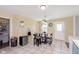 Eat-in kitchen features a tile floor, table with seating, and exterior access at 5646 Skipping Stone Dr, Indianapolis, IN 46237